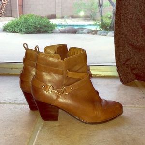Brown heeled ankle booties with gold accent